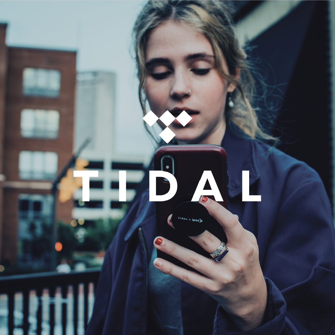 woman checks phone outdoors by the tidal
