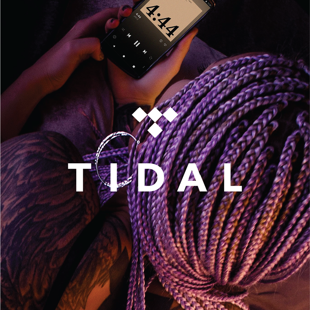 phone displaying music app held by woman at tidal