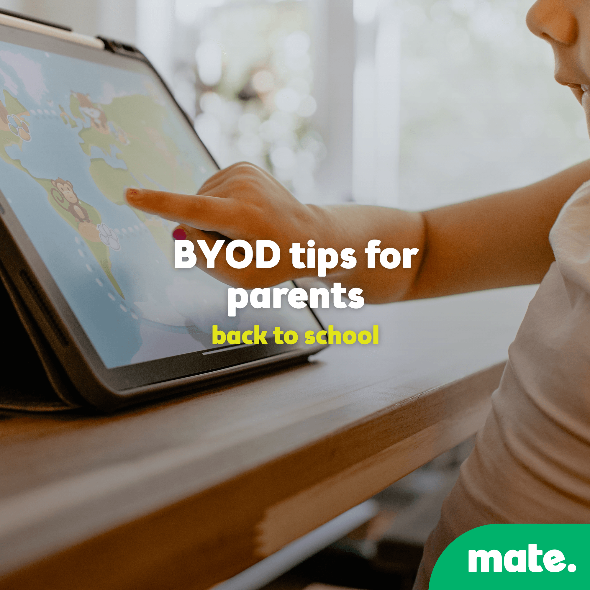 child pointing at tablet screen during back-to-school by the mate brand.