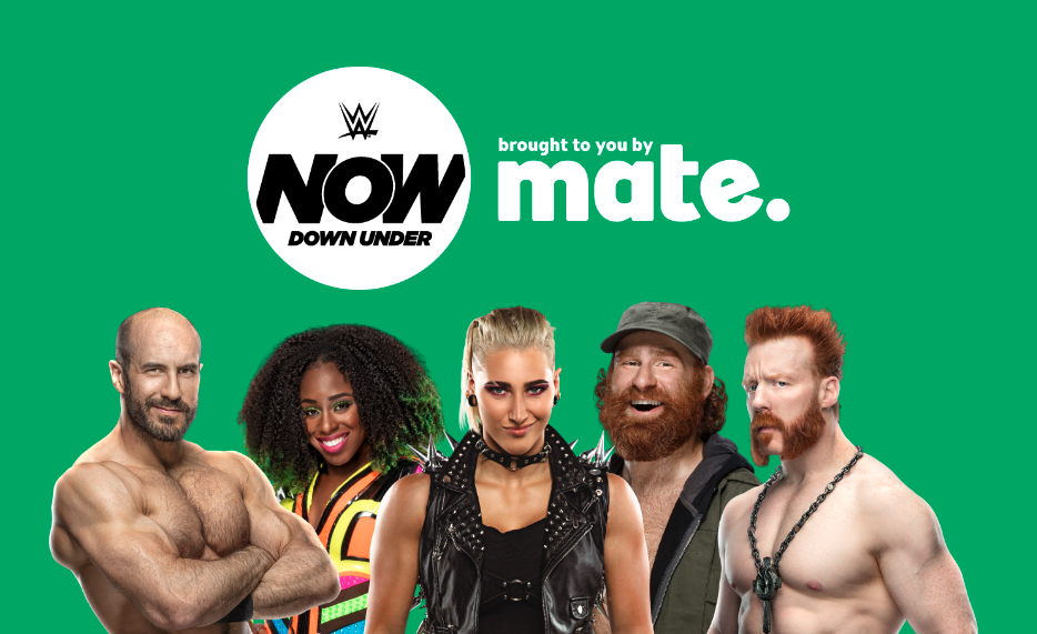 wrestlers posing for wwe now down under at mate event