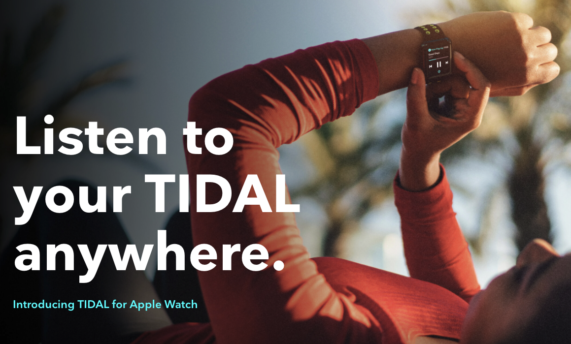 person using smart watch with tidal app outdoors.