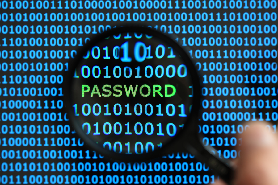 magnifying glass revealing password in binary code background