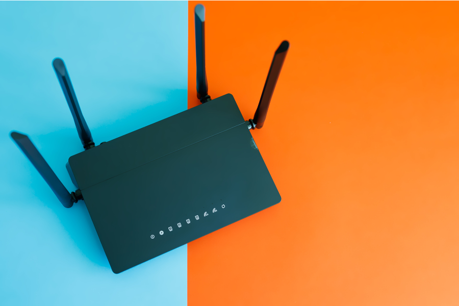 router resting on vibrant blue and orange backdrop