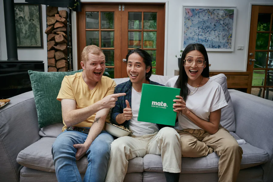three people celebrating with mate internet at home.