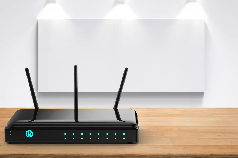 router with antennas operating on wooden table in bright room